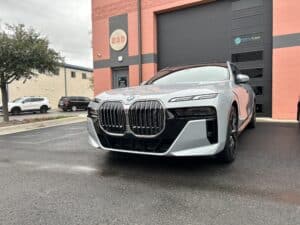 New BMW with Window tint installation parked outside of the shop.